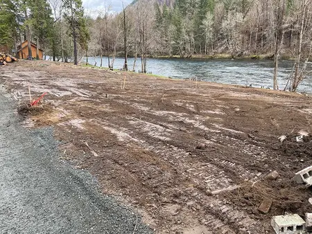 Cleared and graded riverside lot ready for a new home
